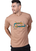 Man wearing ZOE beige Greek cotton T-shirt with colorful lizard art design