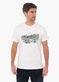 Man wearing ZOE white T-shirt with hand-drawn Crete harbor and ships design, Greek cotton